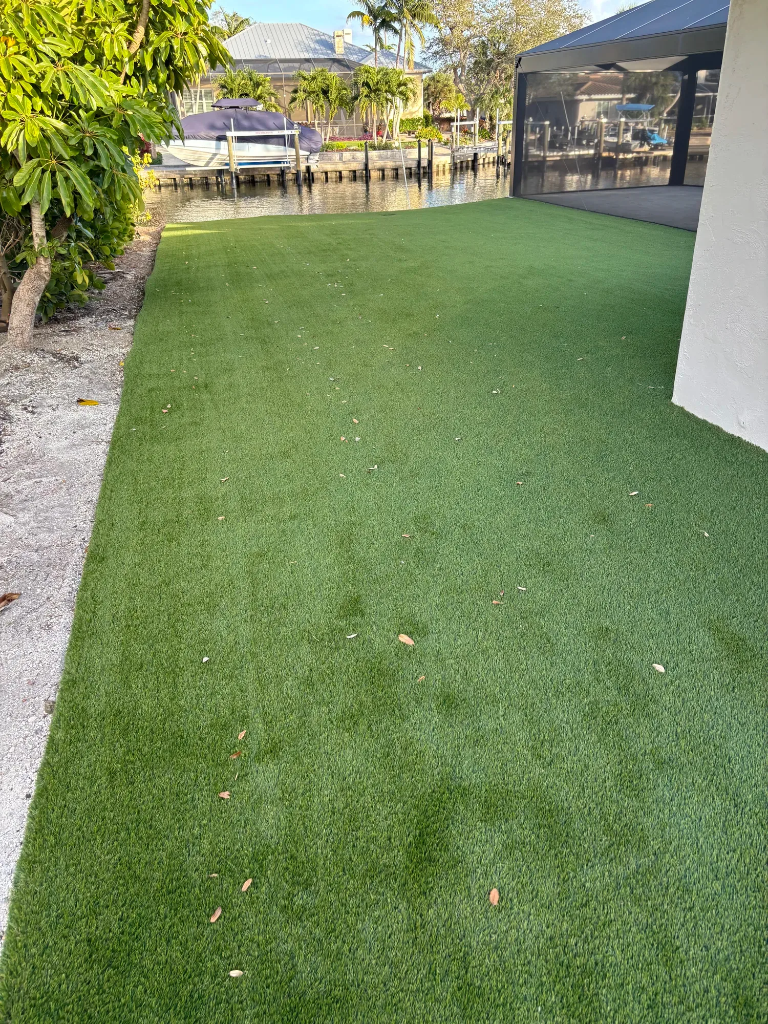 The waterfront yard after artificial turf installation