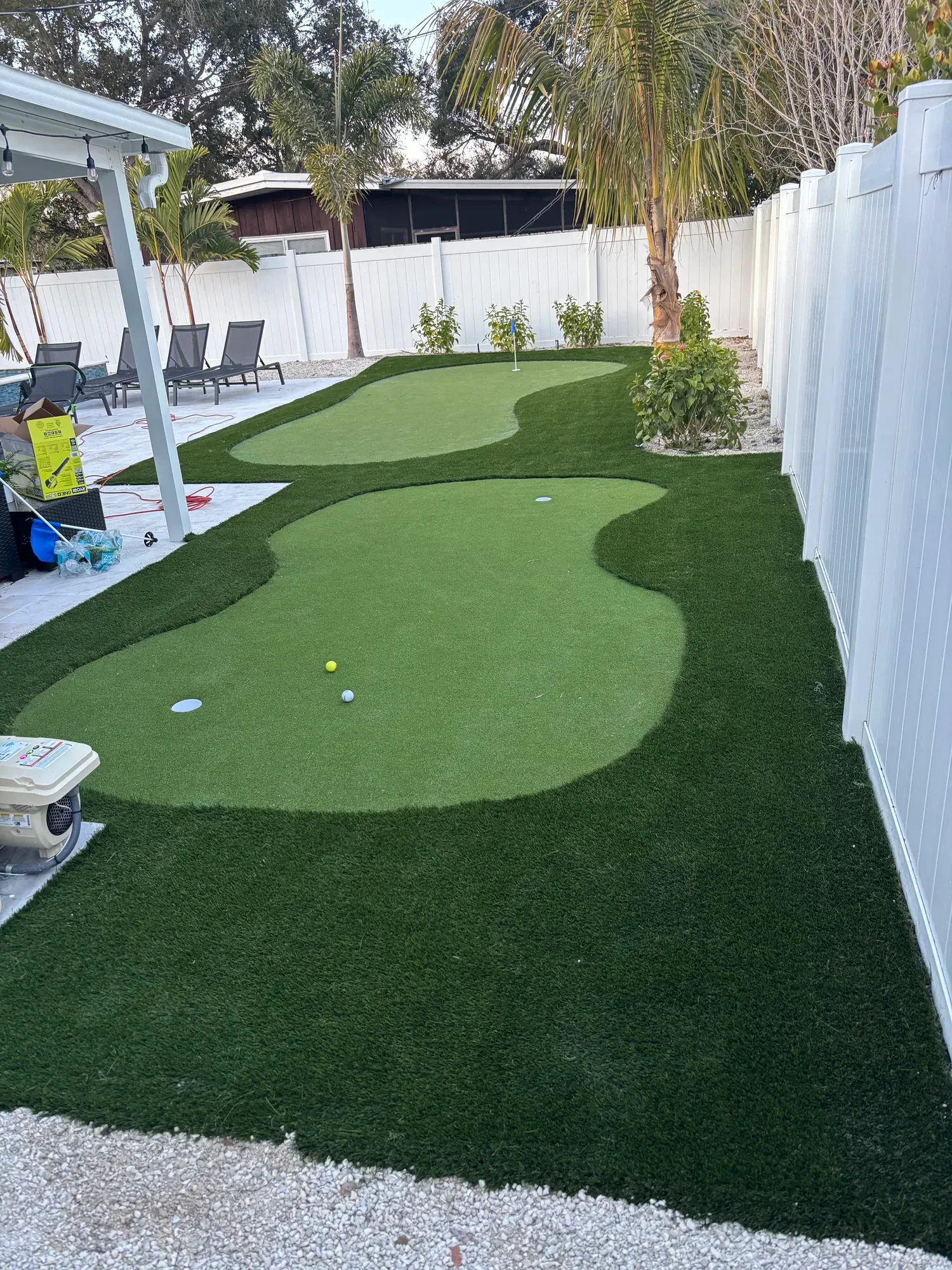 The backyard putting green after artificial turf installation